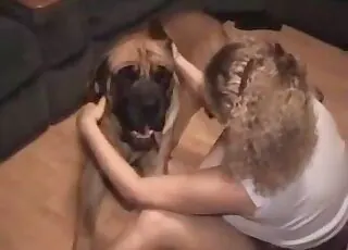 Light haired babe gets tongued by her favorite mutt in this hot zoo sex clip